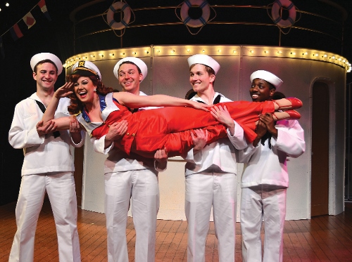 Erma (Sarah Joy Ledtke) sings 'Buddie Beware' to her potential sailor suitors (from left) Blake Spellacy, Ian Frazier, Stephen Barnowski and Sam McKanney in Beef & Boards Dinner Theatre's current production of Anything Goes.
