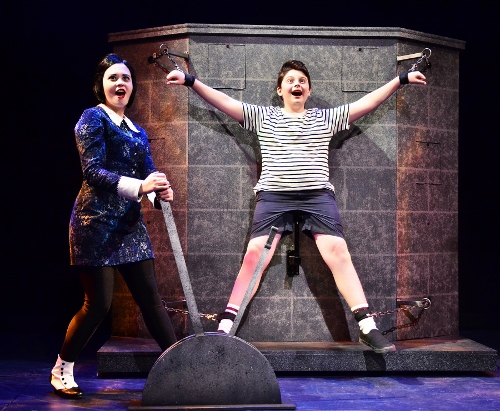 Wednesday Addams (Samantha Russell), left, tortures her younger brother Pugsley (Simon Barnes) as she admits being “Pulled” in a new direction with her love for Lucas in Beef & Boards Dinner Theatre’s production of the musical comedy The Addams Family, now on stage through Nov. 22.