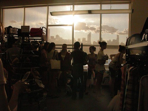 The line at the cash register with the silhouetted skyline