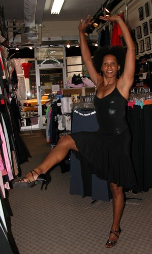 Black top by Baltogs. Flared black skirt by Body Wrappers. Black 'Sophia' shoes by Freed of London. Modeled by Kendra Jackson. Available at <a href='http://www.onstagedancewear.com'>OnStageDancewear.com</a>.