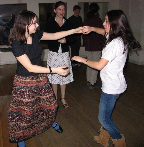 Tili Sokolov, 16, and Molly Zimetbaum, 15, practice a dance move at Arthur Murray Studio in Boston as teacher Christine McCarthy looks on approvingly.
